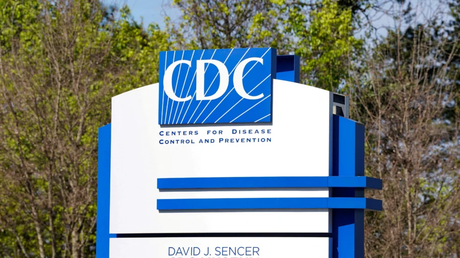 A sign sits outside the Centers for Disease Control and Prevention (CDC) Roybal campus in Atlanta, Georgia, on March 18, 2026. (Megan Varner/Reuters) — Image credit: CDC Will Not Publish Report Showing COVID-19 Vaccine Effectiveness | NTD