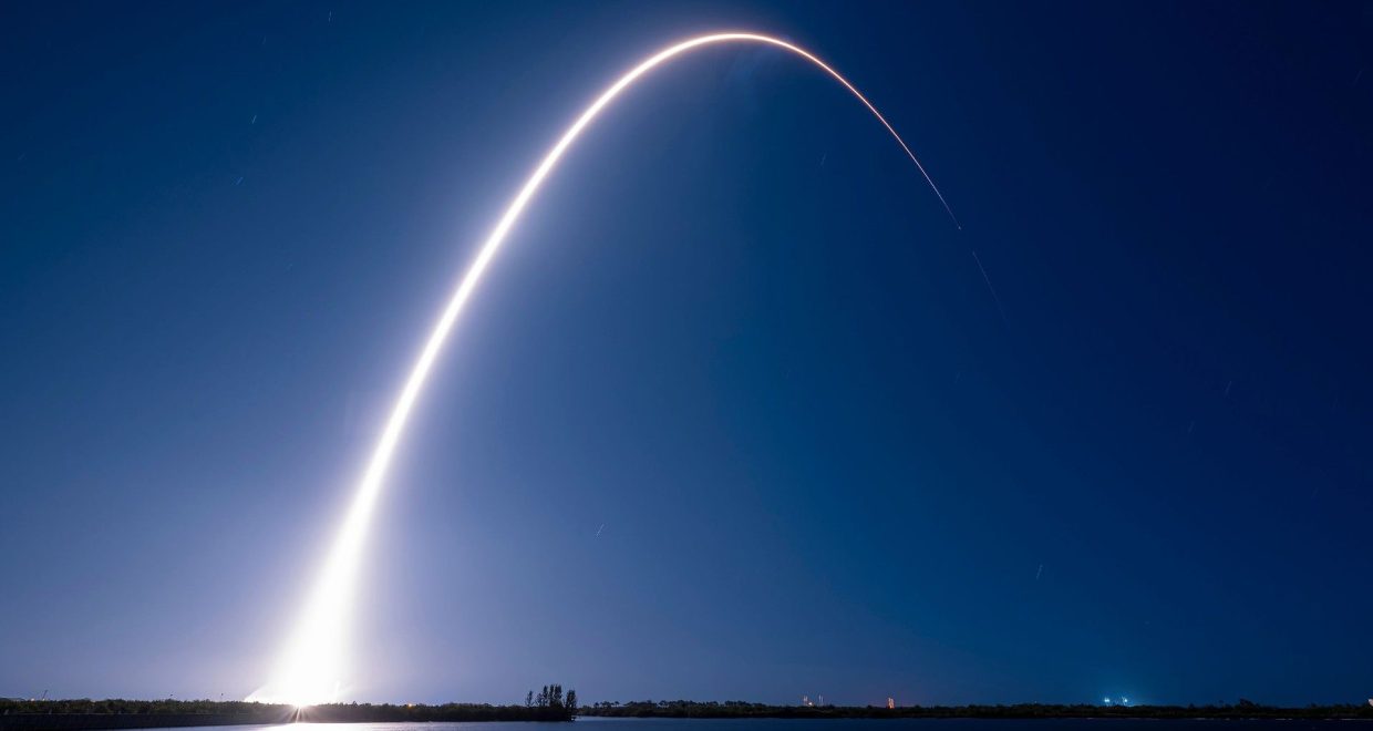 an arc of light streaks through the night sky — Image credit: SpaceX rocket debris could slam into the moon: Here's what you need to know | Space / https://www.space.com/author/leonard-david